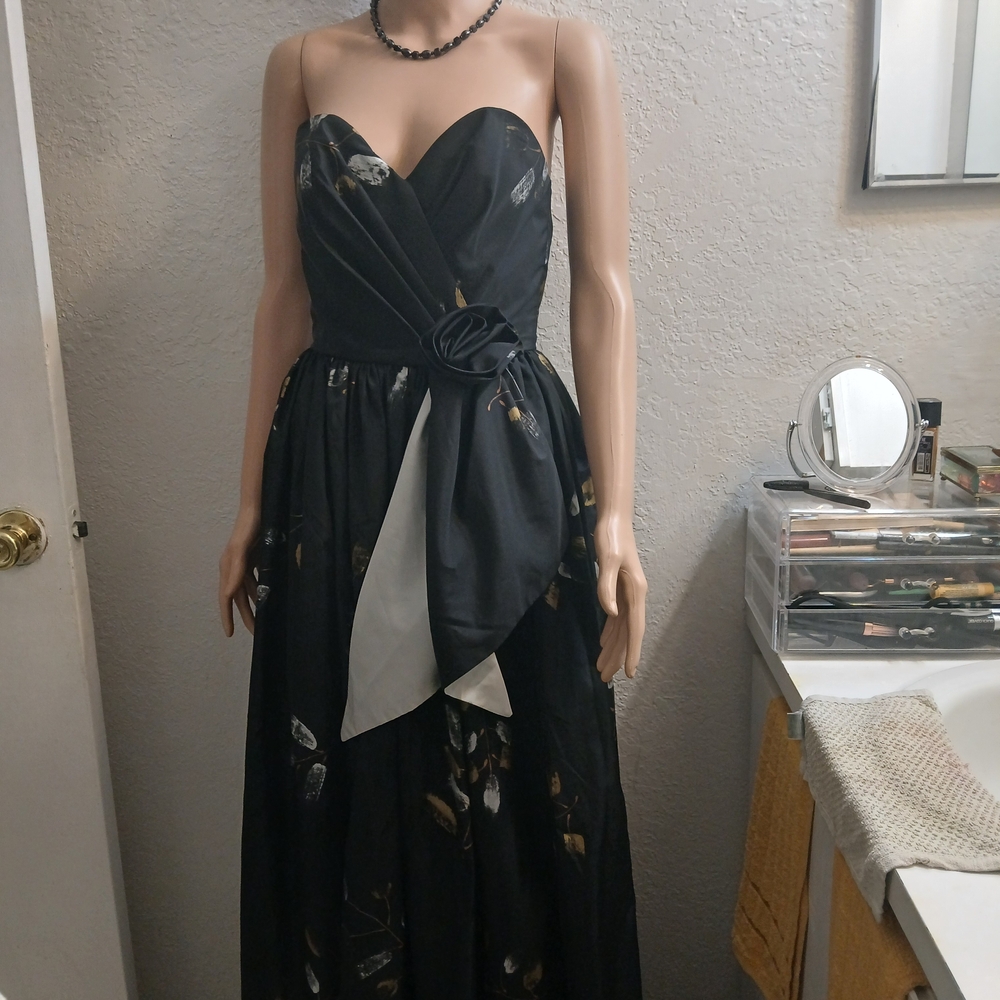 Chic Black Strapless Gown with Floral Accents